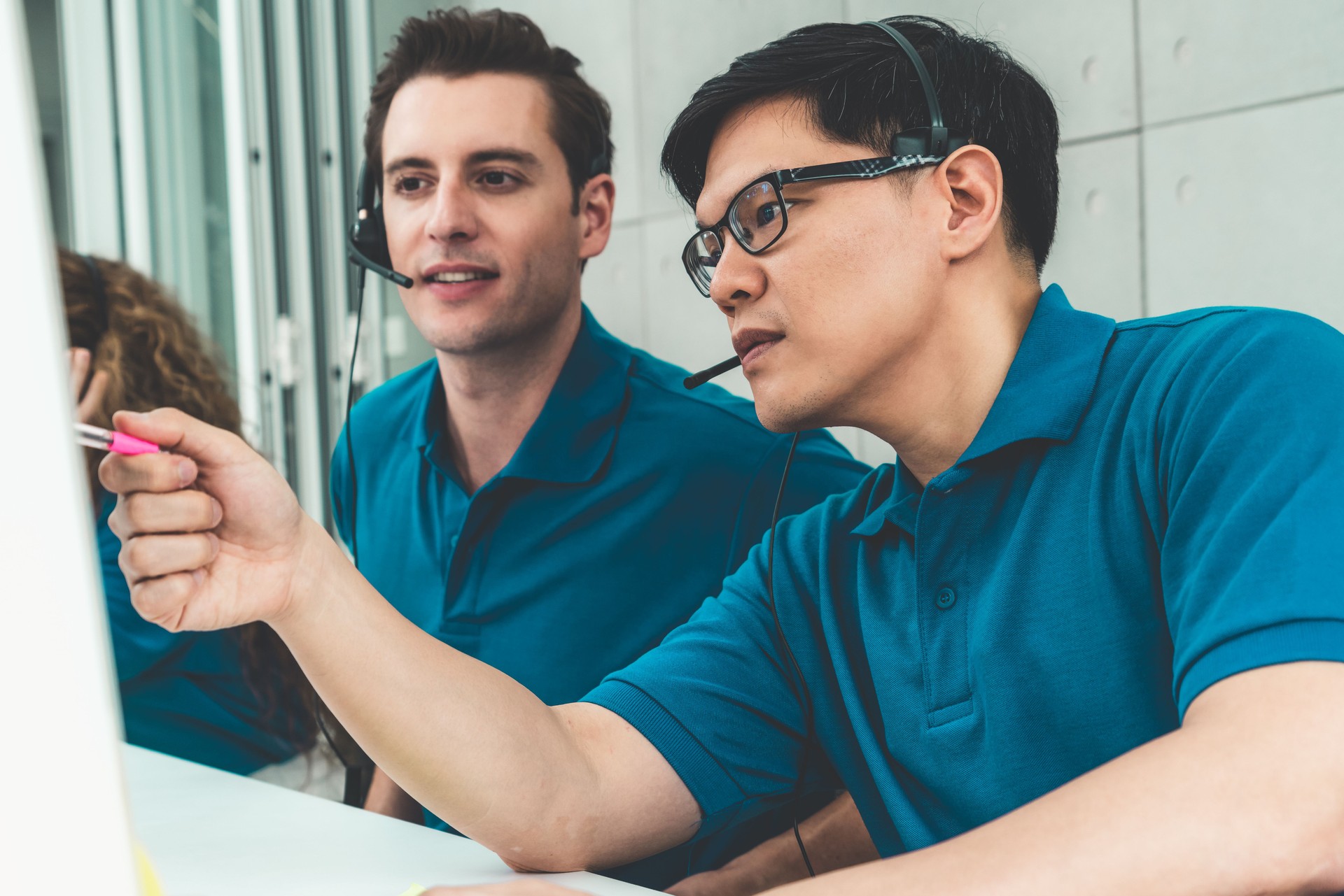 Business people wearing headset working in office